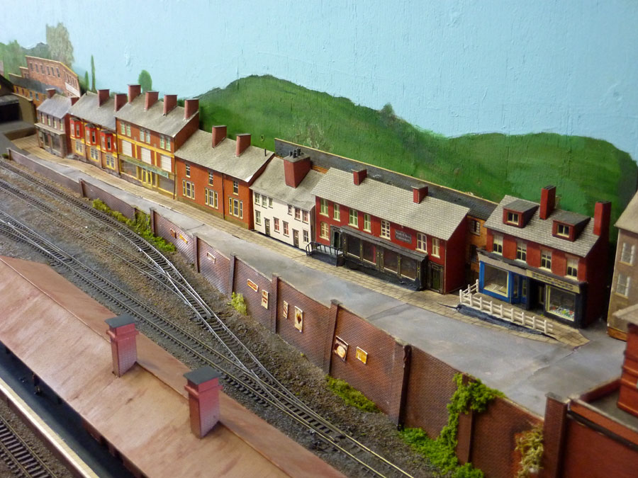 April saw some drastic work carried out on the scenery at the back of the layout. It was time for a fairly tired-looking row of shops and houses to be demolished in favour of building a trading estate (that's progress for you).