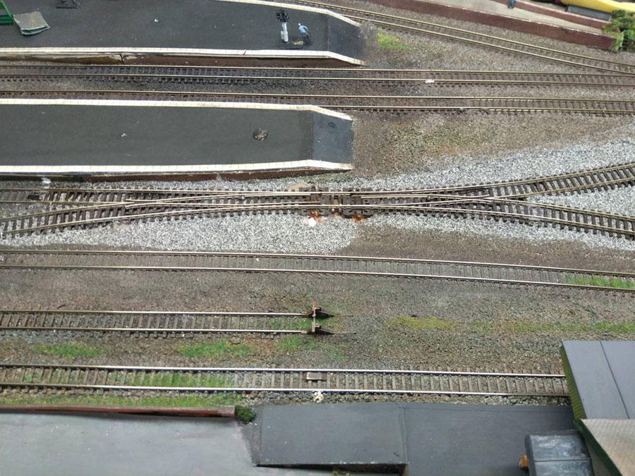 The hole was so deep, and even the in-fill was a little low, that ballasting would have to be done in two layers. The first was added to fix the track in place.
