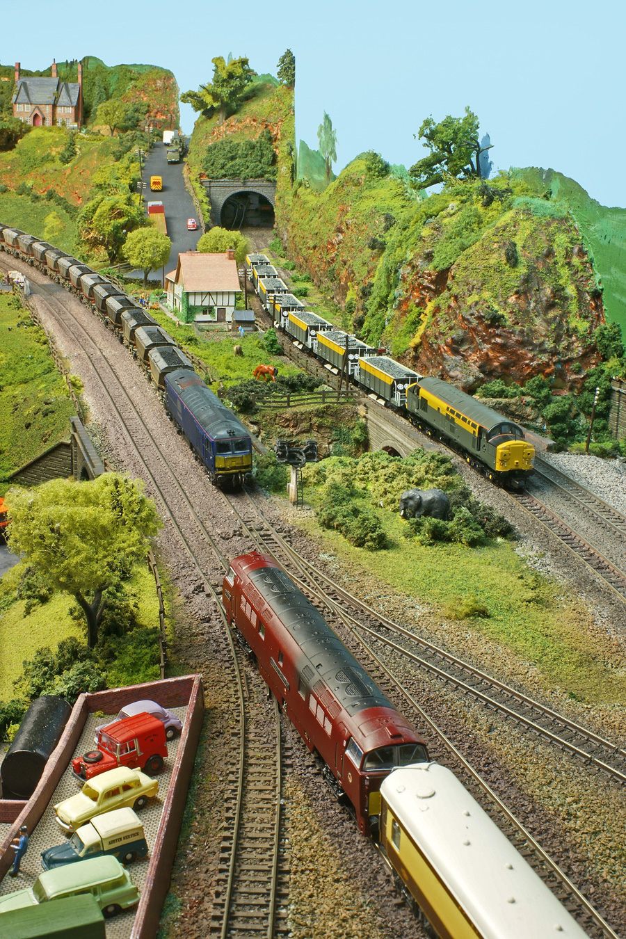 A Class 60 and a Class 37 both bring freight workings towards Bridgebury Gate at the same time, although the Class 37, on the branch line, will have to give way.