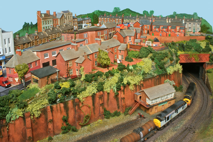 The townscape at the right-hand end of the layout, which hides the curve to the fiddle yard at the back, was made largely from Metcalfe kits.